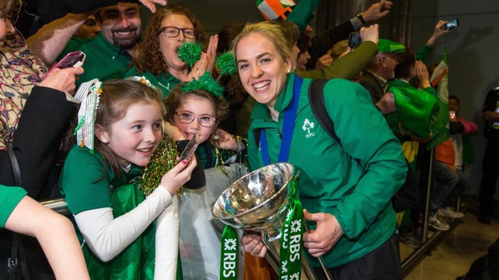 Ireland captain Niamh Briggs greets supporters on her side’s triumphant return to Dublin airport following their Six Nations win. Photograph: Inpho
