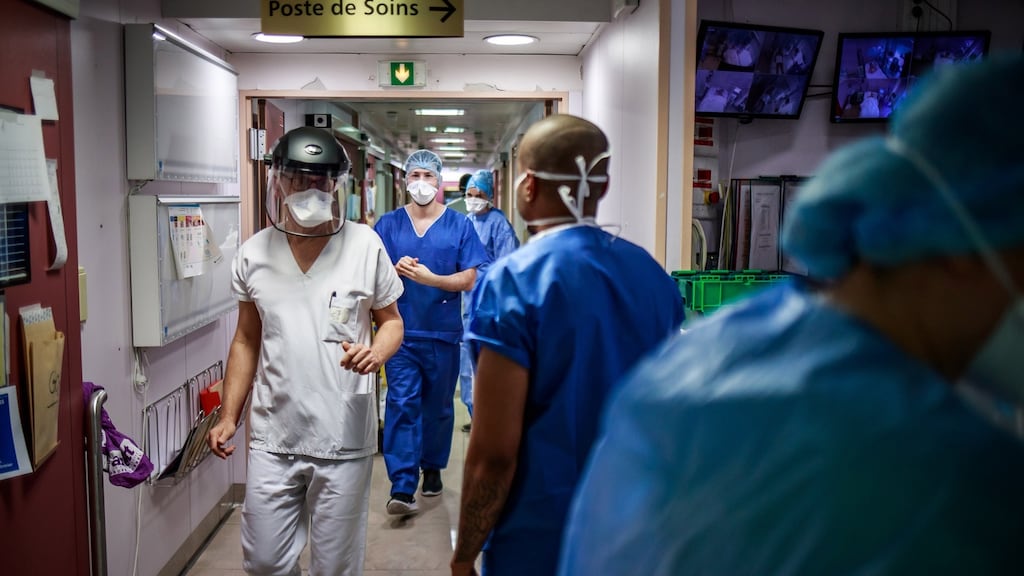 Medical staff wear protective gear in Neuilly-sur-Seine, near Paris. Photograph: Christophe Petit Tesson/EPA