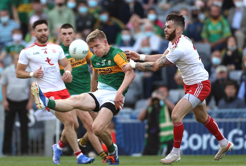 Tommy Walsh tries to score a late point to level the All-Ireland semi-final under pressure from Tyrone's Ronan McNamee at  Croke Park  last August.  It was his final appearance in a Kerry jersey.  Photograph: James Crombie/Inpho