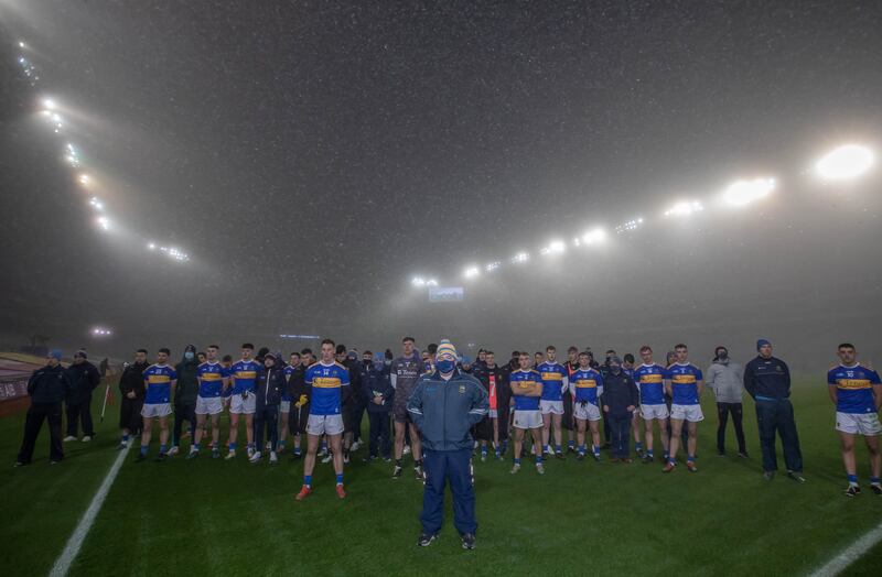 Tipperary players and management stand for a minute's silence at Croke Park on December 6th, 2020 after laying a wreath at the Bloody Sunday memorial. Photograph: Morgan Treacy/Inpho