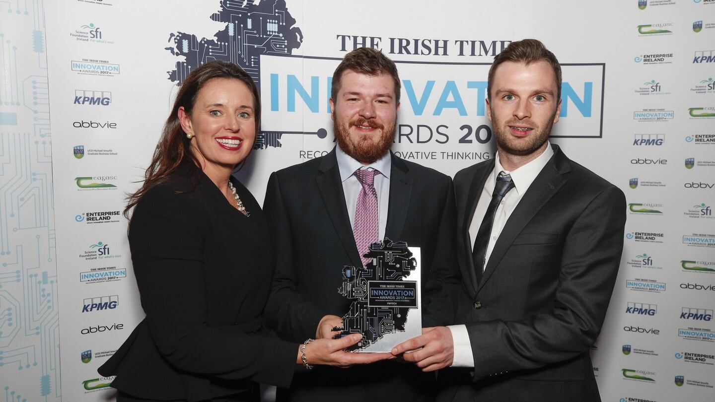 Anna Scally, KPMG, presenting the award for Fintech to David Geraghty and Daíre Hickey from DOCOsoft. Photograph: Conor McCabe Photography