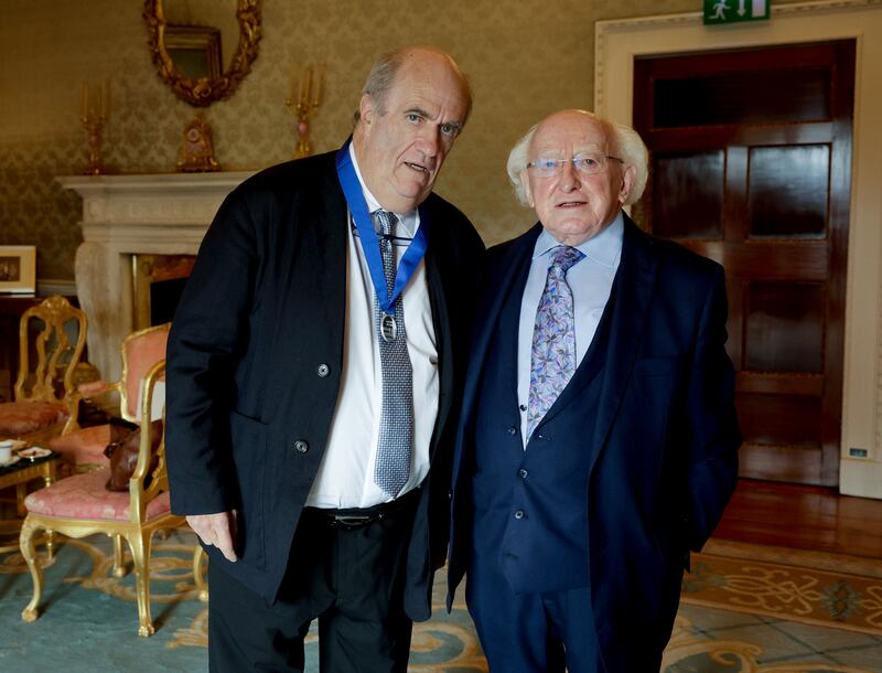 President Michael D Higgins presents Colm Tóibín with his Laureate medal ahead of his inaugural lecture as the Laureate for Irish Fiction 2022-2024. Photograph: Maxwells