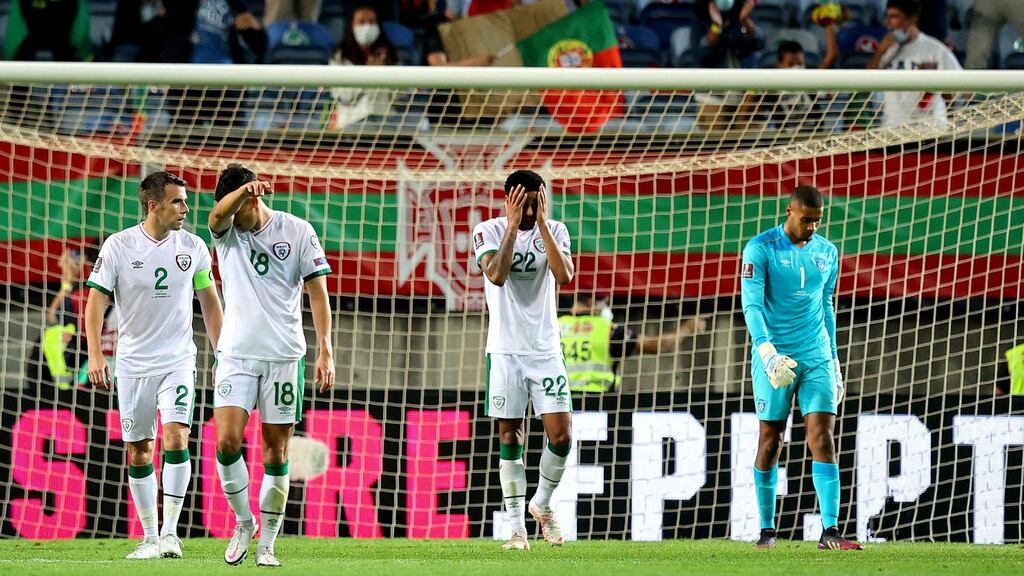 Ireland’s Séamus Coleman, Jamie McGrath, Andrew Omobamidele and Gavin Bazunu dejected after the concession of a goal in the World Cup qualifier against Portugal. Photograph: Ryan Byrne/Inpho