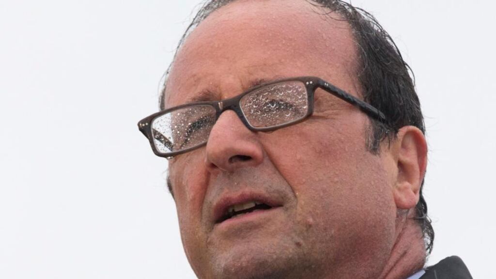 Fuzzy policies: François Hollande speaks in the rain this week. Photograph: Philippe Wojazer/Reuters
