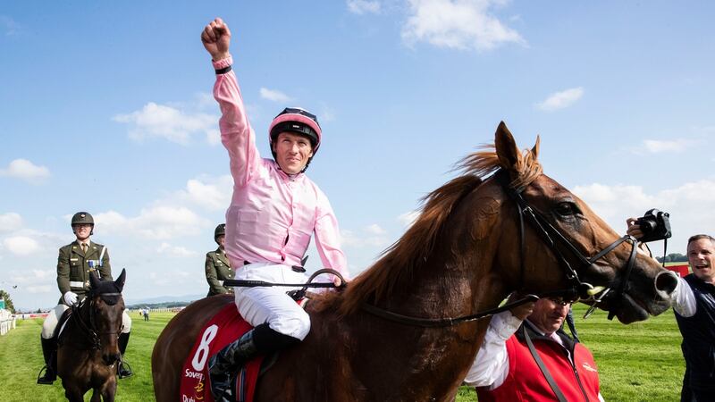 Jockey Pádraig Beggy celebrates winning the Dubai Duty Free Irish Derby on Sovereign. Photograph: Morgan Treacy/Inpho