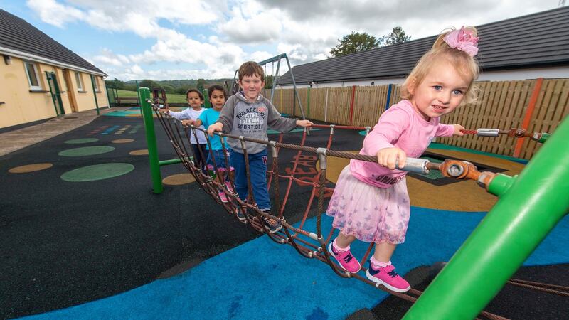 Hearing the children in the playground on the other side of her garden wall “is great craic”, says resident Bridie Dillon. Photograph: Michael MacSweeney/Provision
