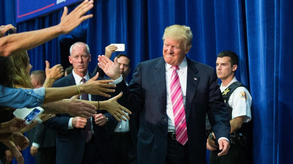 Donald Trump arrives at a campaign rally in Fredericksburg, Virginia: his newly appointed campaign manager Kellyanne Conway appeared to suggest on CNN on Sunday that the Republican nominee may be willing to back down on one of his most radical immigration proposals. Photograph: Al Drago/The New York Times
