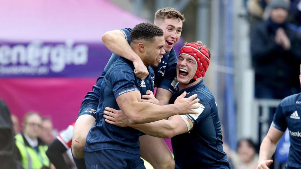 Adam Byrne celebrates his try against Toulouse with Leinster teammate’s Jordan Larmour and Josh van der Flier Photograph: Dan Sheridan/Inpho