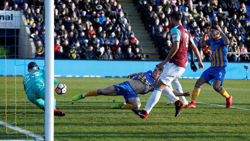 Shrewsbury Town’s James Bolton pokes past West Ham United’s Joe Hart during their FA Cup clash. Photo: Andrew Yates/Reuters