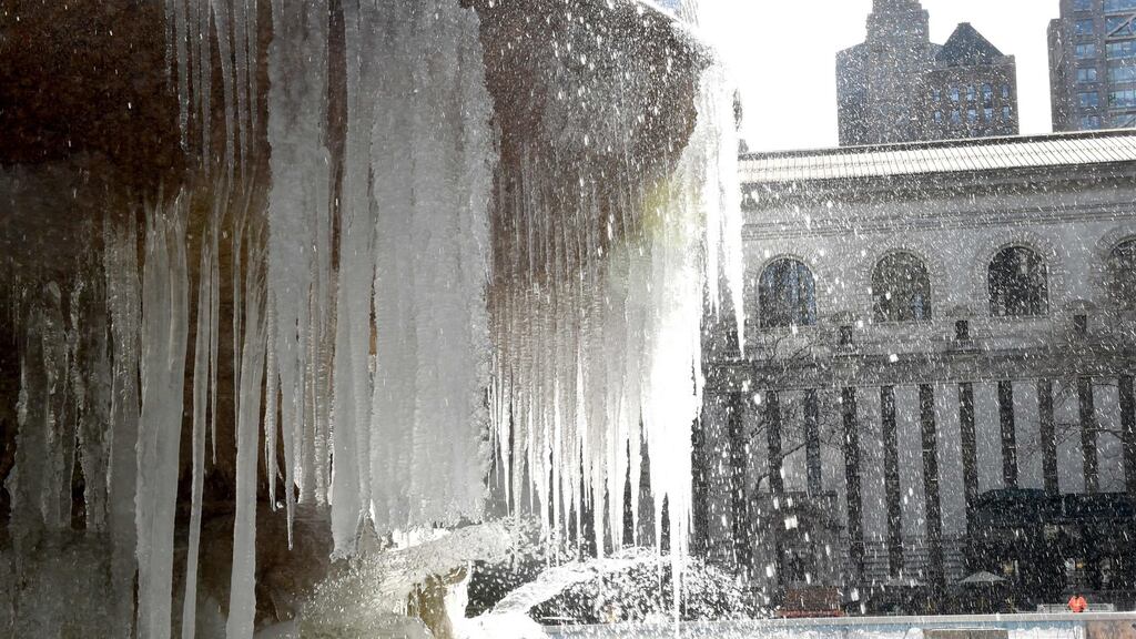 A fountain is covered in ice on Monday as the weather in US continues to be below freezing. Photograph: Timothy A Clary/EPA/Getty Images