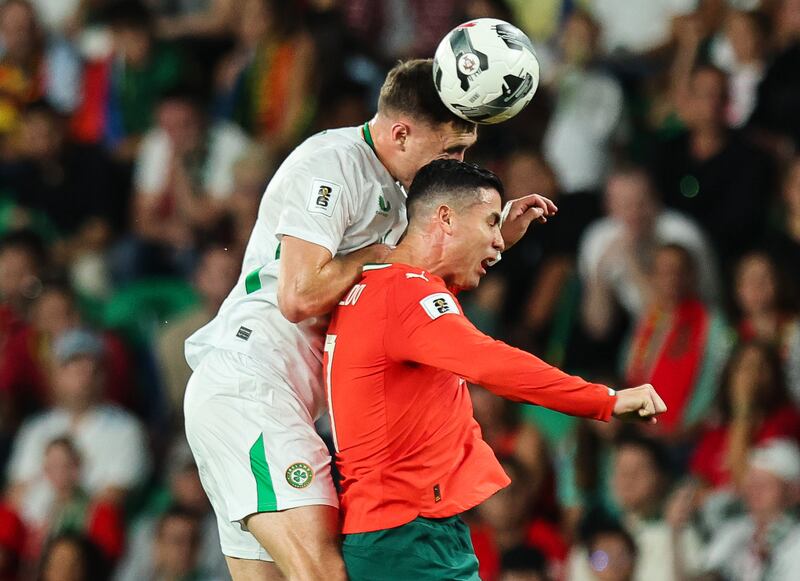 Dara O'Shea in action against Portugal’s Cristiano Ronaldo. Photograph: Ryan Byrne/Inpho
