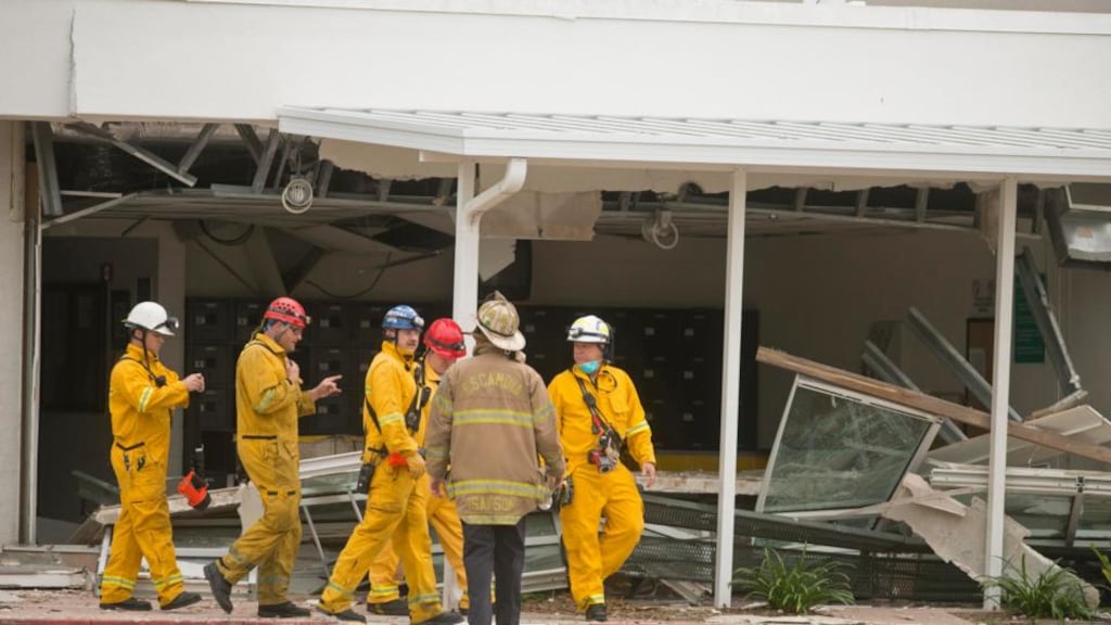 Rescue personnel enter Escambia County jail in Pensacola, Florida, yesterday. Photograph: Reuters
