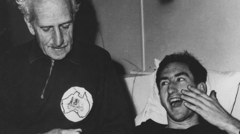 Percy Cerutty checks the pulse of Herb Elliott in 1960. Photograph: Allsport /Hulton Archive