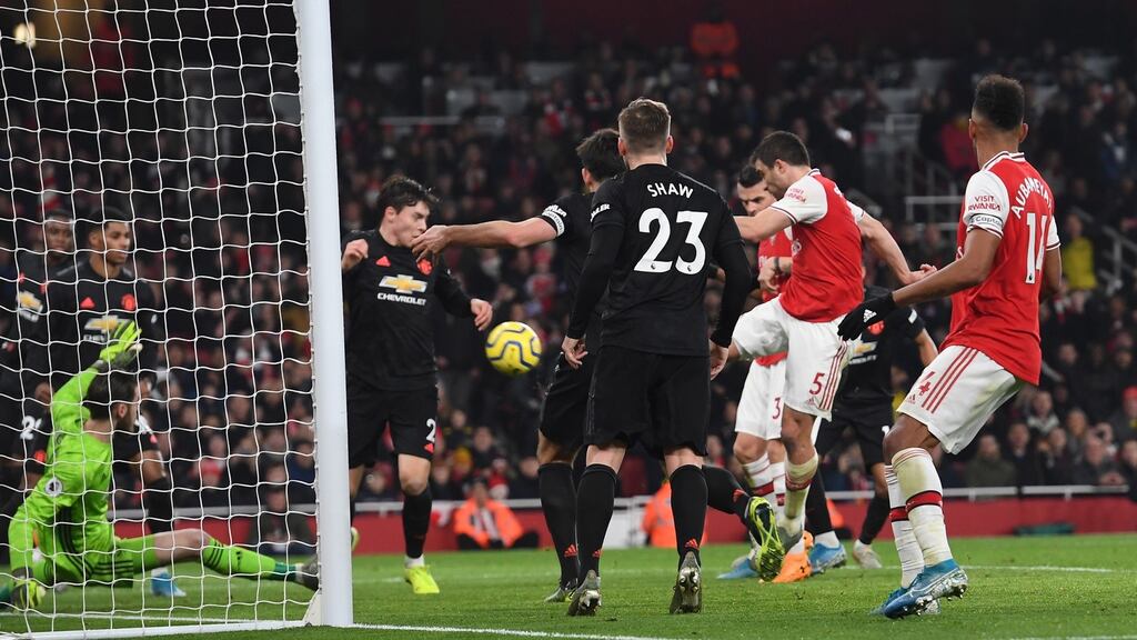 Sokratis scores the second for Arsenal in their Premier League clash with Manchester United. Photo: Andy Rain/EPA