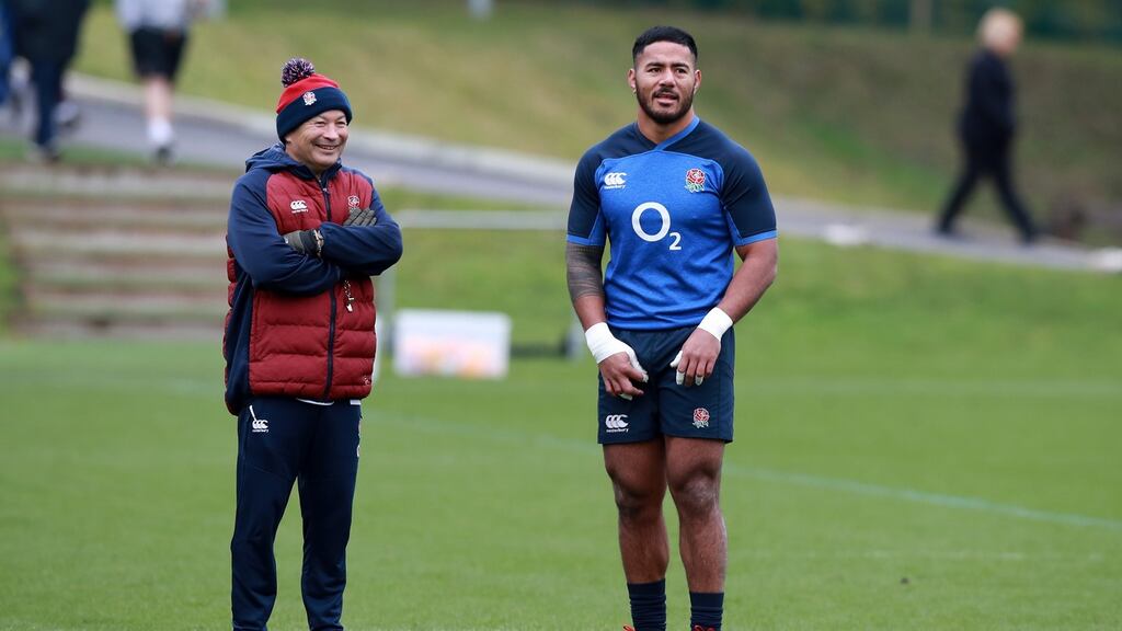 England head coach Eddie Jones with Manu Tuilagi during an England training session at Pennyhill Park. Photograph: Getty Images