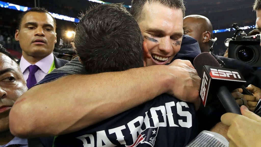 New England Patriots quarterback Tom Brady (back) celebrates with a teammate after defeating the Atlanta Falcons to win Super Bowl LI in Houston on Sunday. Photograph: Reuters/Adrees Latif