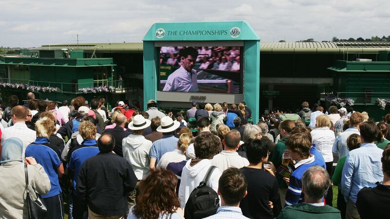 Spectators watch the action on the big screen from ‘Henman Hill’ during the men’s singles second-round match between Tim Henman and Feliciano Lopez of Spain in 2007. Photograph: Alex Livesey/Getty Images