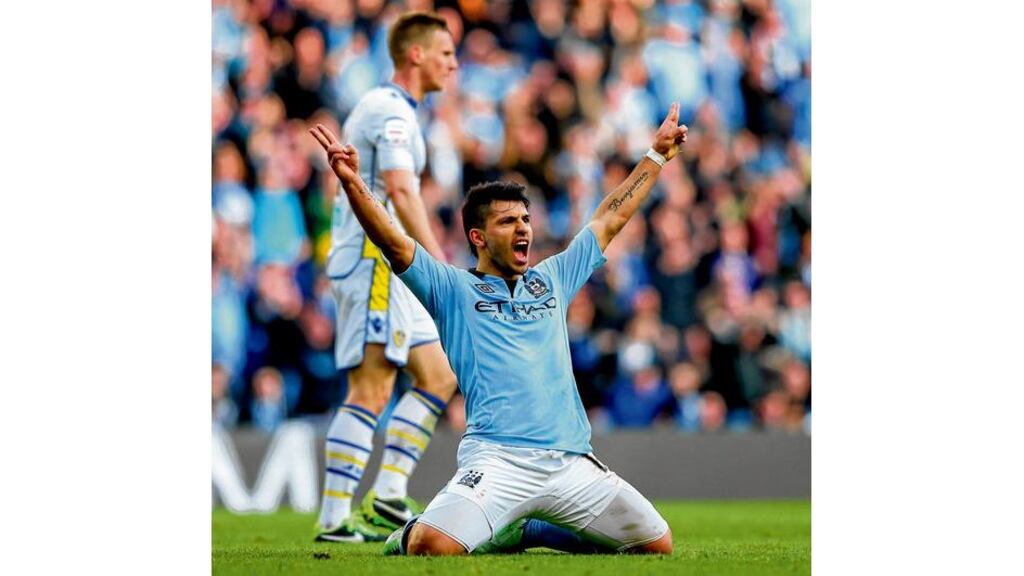 Sergio Aguero drops to his knees after curling a shot past Jamie Ashdown for City's fourth goal. Photograph: Alex Livesey/Getty Images