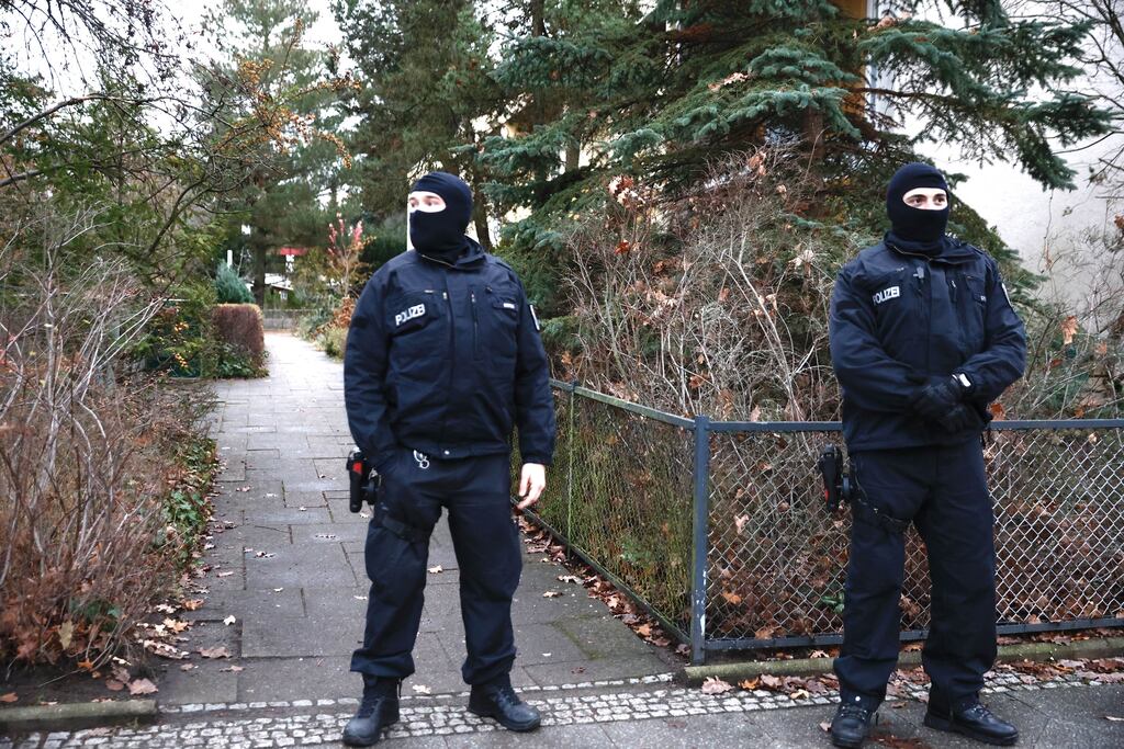 Police stand outside a residence that they raided on Wednesday as part of efforts to foil an organisation they claim aims to violently overthrow the German government. Photograph: Carsten Koall/Getty Images)