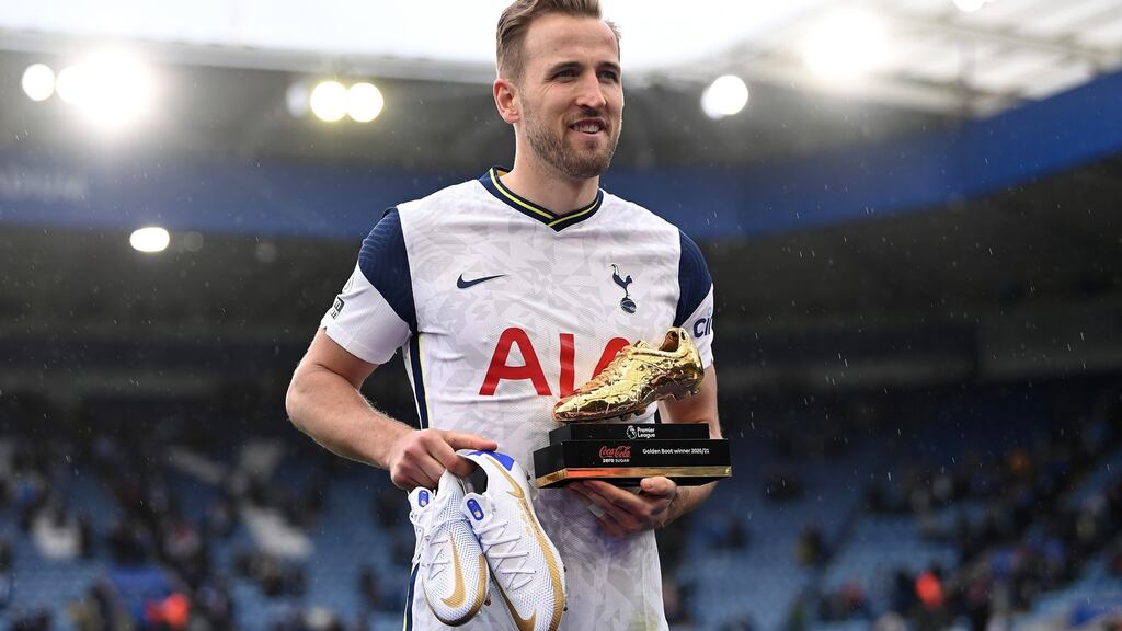 Harry Kane poses with the Golden Boot after Spurs secured seventh place in the Premier League. Photograph: Laurence Griffiths/Getty