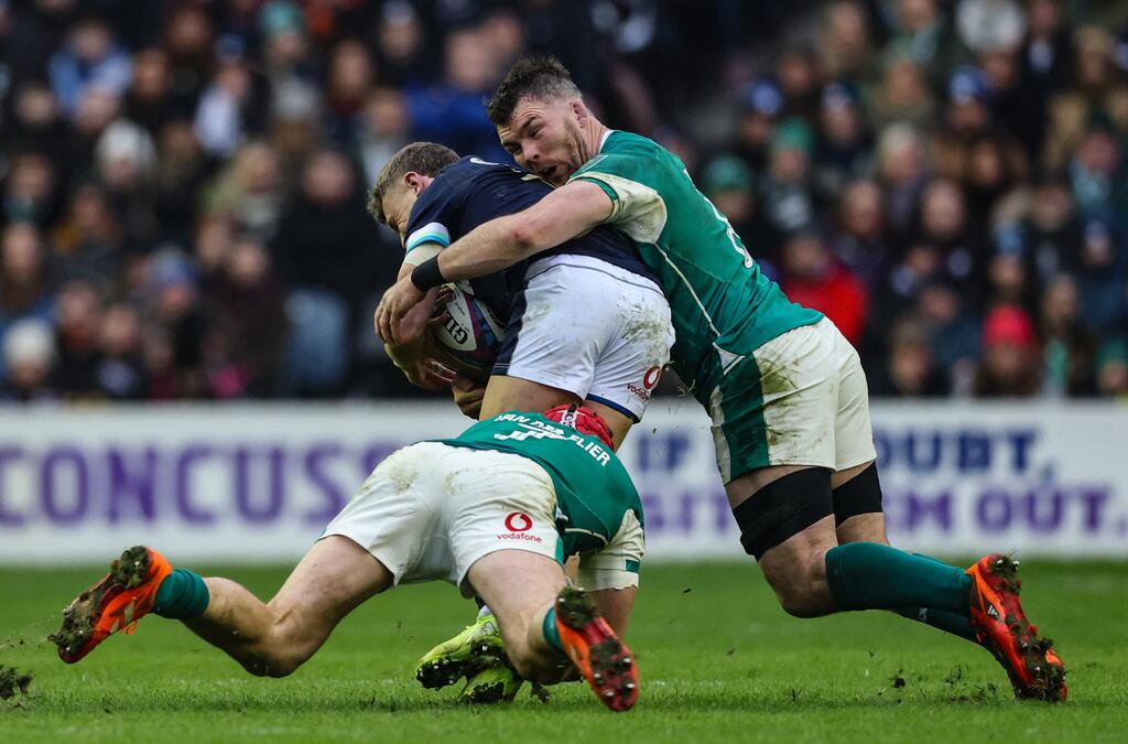 Peter O’Mahony and Josh van der Flier tackle Scotland's Darcy Graham in Sunday's Six Nations games at Murrayfield. Photograph: Billy Stickland/Inpho