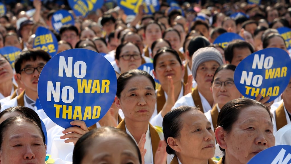 Won Buddhism practitioners pray during a rally in Seoul on Tuesday called to oppose the South Korean government’s defence policy. Photograph: Kim Chul-Soo/EPA