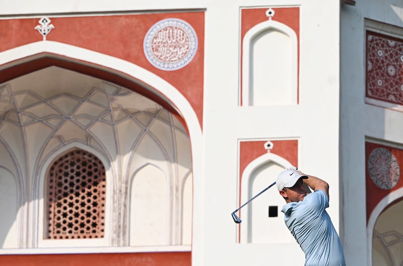 Rory McIlroy tees off on the 14th hole. Photograph: Prakash Singh/Getty