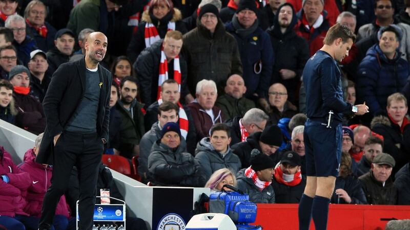 Manchester City manager Pep Guardiola complains to referee Felix Brych during his side’s 3-0 defeat at Anfield. Photograph: Peter Byrne/PA