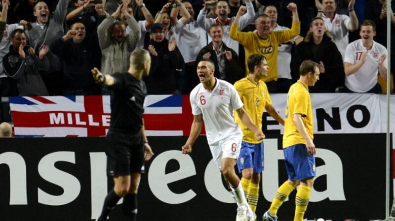 Steven Caulker celebrates scoring on his England debut against Sweden. Photograph: Jonathan Nackstrand/Getty