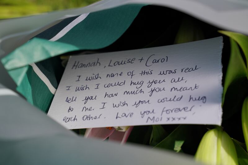 A message on a floral tribute near to the scene. Photograph: Jonathan Brady/PA Wire