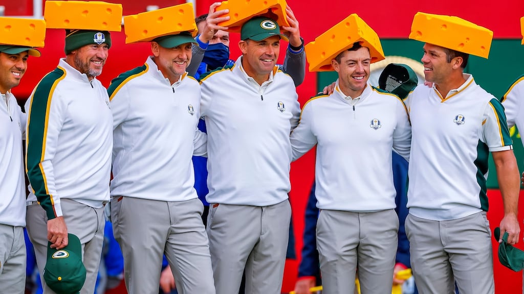 European team members Lee Westwood, Ian Poulter, captain Pádraig Harrington, Rory McIlroy and Paul Casey pose wearing cheese heads before a practice round at the Ryder Cup. Photo: Erik S. Lesser/EPA