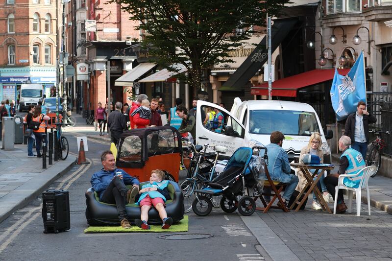 Colm and Ruari (9) Walsh from Rathmines enjoying some couch time on Dublin’s South William Steet during the protest. Photograph: Nick Bradshaw/The Irish Times