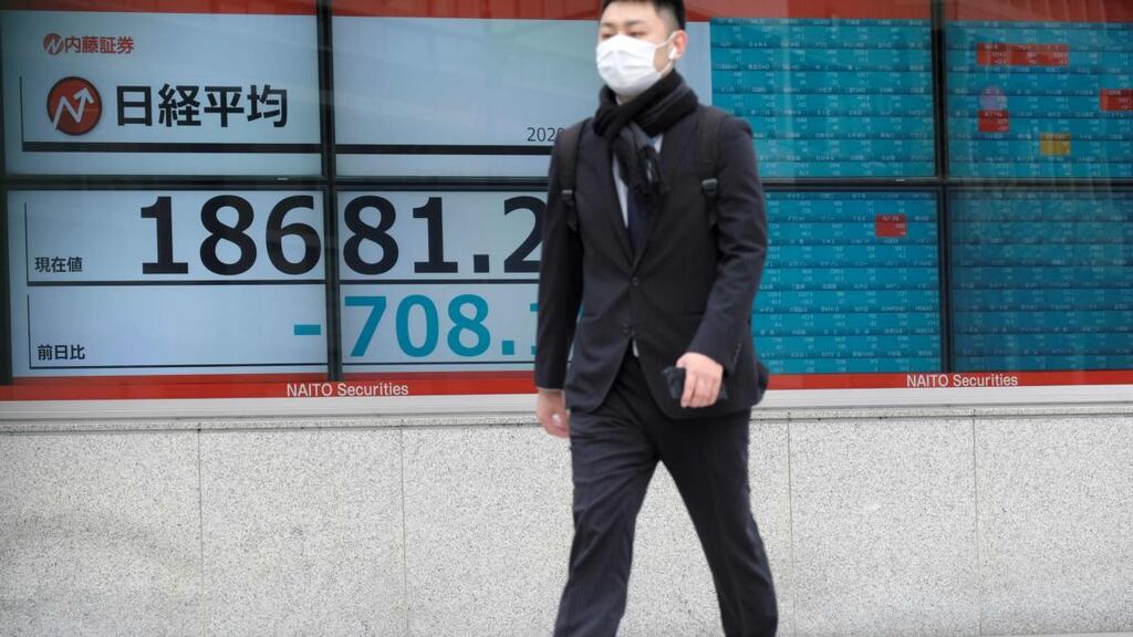 Optimists hope that the financial impact is sharp but brief as policymakers throw the kitchen sink at the economy. Photograph: Kazuhiro Nogi/AFP via Getty Images)