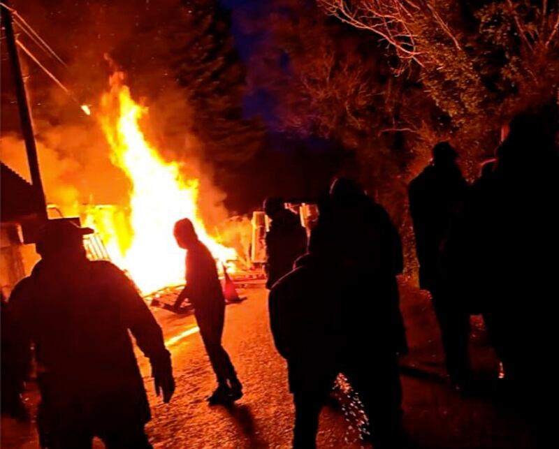 A screengrab from a social media posting shows a fire near the site in Newtouwnmountkennedy where gardaí and protestors clashed on Thursday. Photograph: X/Twitter