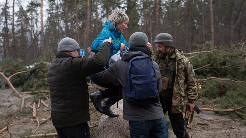 Civilians evacuate from the shelled city of Irpin in Ukraine on Sunday. Photograph: Anastasia Vlasova/Getty Images