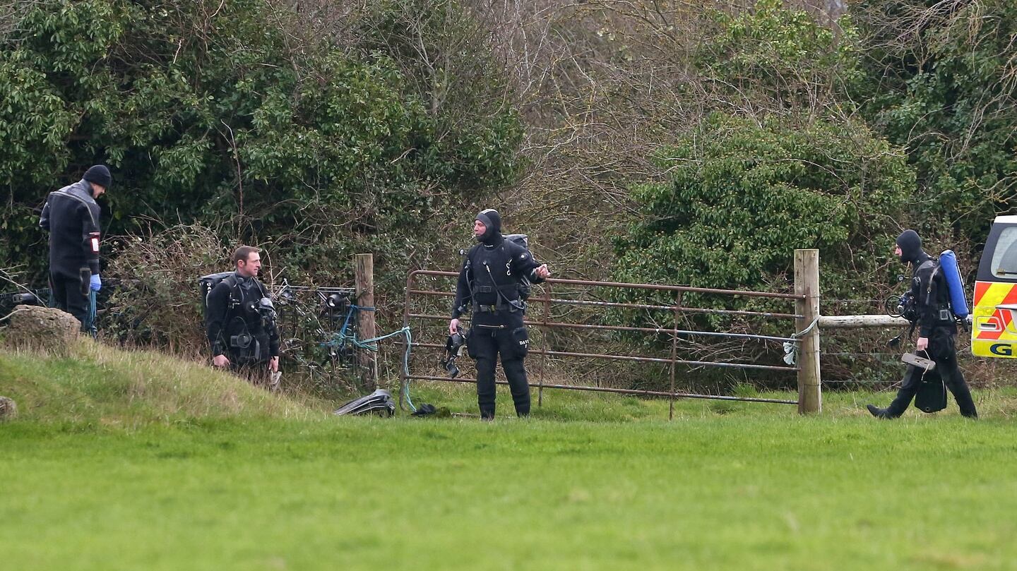 Members of the Garda underwater unit search farmhouses and a lake in the area around where the dismembered body of Kenneth O’Brien was found in a canal. Photograph: Collins