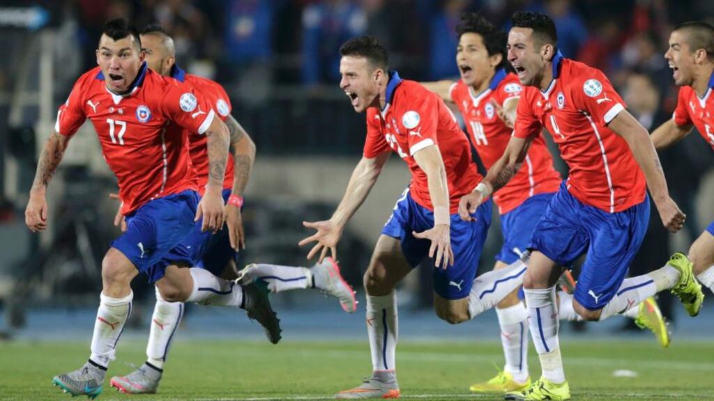 Chile players celebrate after defeating Argentina in the Copa America 2015 final. Photograph: Jorge Adorno/Reuters