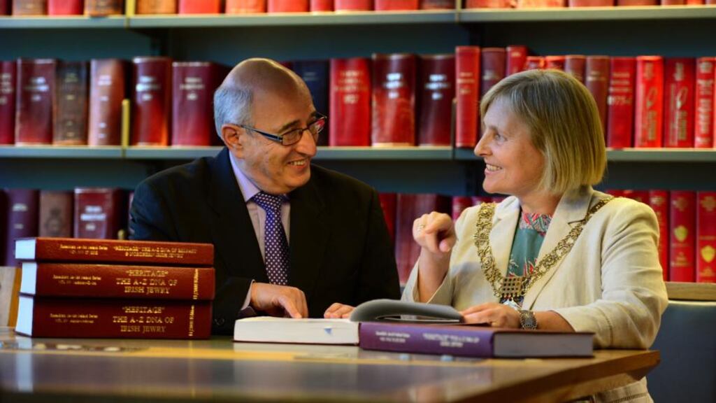 Stuart Rosenblatt, president of the Genealogical Society of Ireland, and Lord Mayor of Dublin Críona Ní Dhálaigh with the genealogical lists at Dublin City Council’s Library and Archive on Pearse Street. Photograph: Dara Mac Dónaill