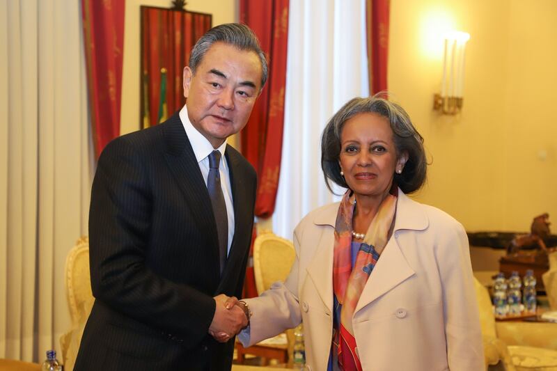 China’s foreign minister, Wang Yi (left), and Ethiopia’s president, Sahle-Work Zewde, shake hands ahead of a meeting at the national palace in Addis Ababa on January 3rd Photo by Michael Tewelde/AFP/Getty