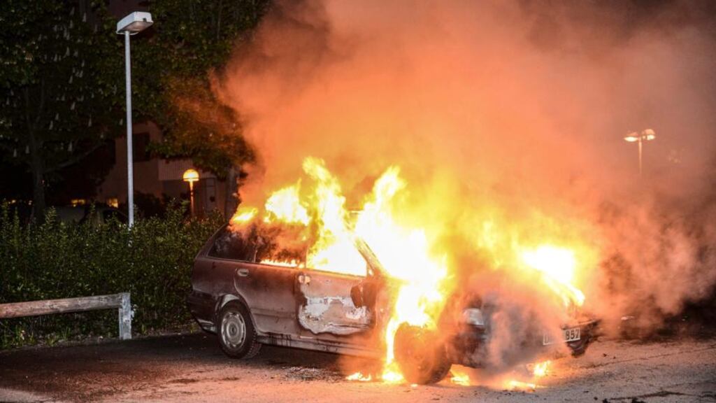 A car set on fire burns, following riots in the Stockholm suburb of Kista. Sweden’s capital has been hit by some of its worst riots in years after youths scorched dozens of cars, attacked a police station and threw stones at rescue services in its poor immigrant suburbs for a third night running. Photograph: Fredrik Sandberg/Scanpix/Reuters