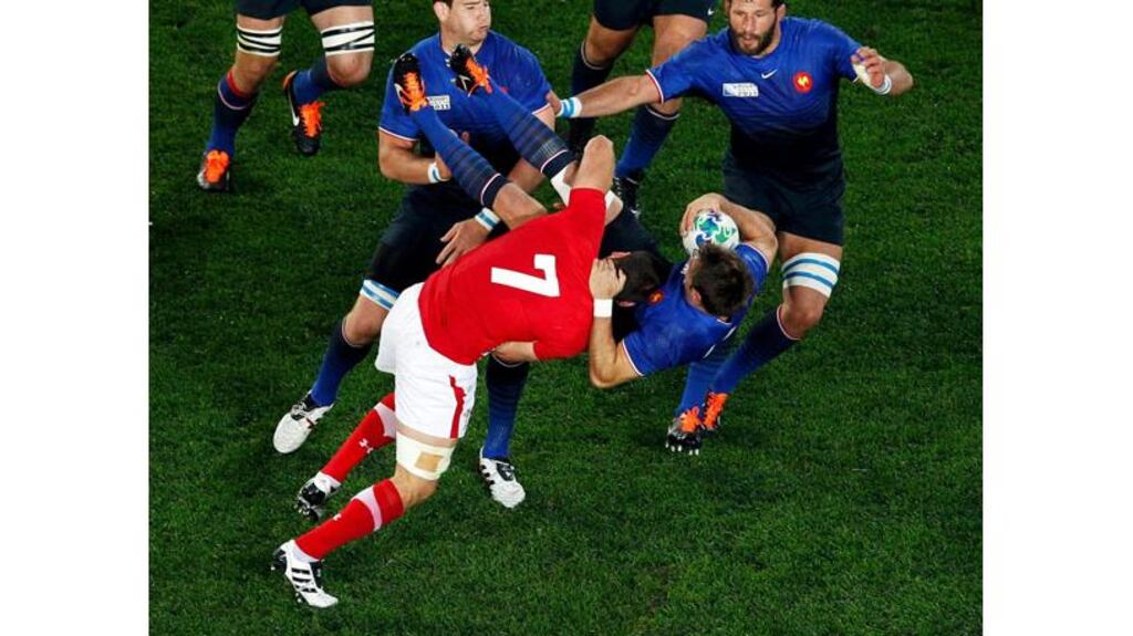 Flanker Sam Warburton tackles French wing Vincent Clerc in the 19th minute of the first Rugby World Cup semi-final in Auckland. The captain was red-carded afterwards and Wales played the remainder of the game with 14 men, losing by a point to Marc Lievremont's side. - (Photograph: Nigel Marple/Reuters)
