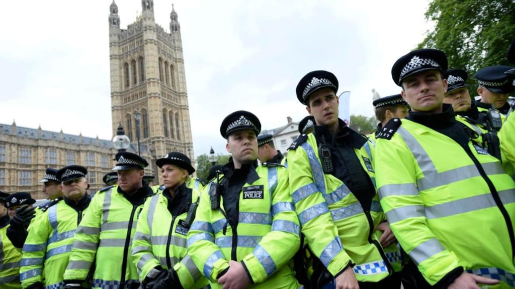 Police officers form a cordon during a demonstration held by the far-right British National Party (BNP) and a counter-demonstration by Unite Against Fascism (UAF) in central London today. Photograph: Dylan Martinez/Reuters