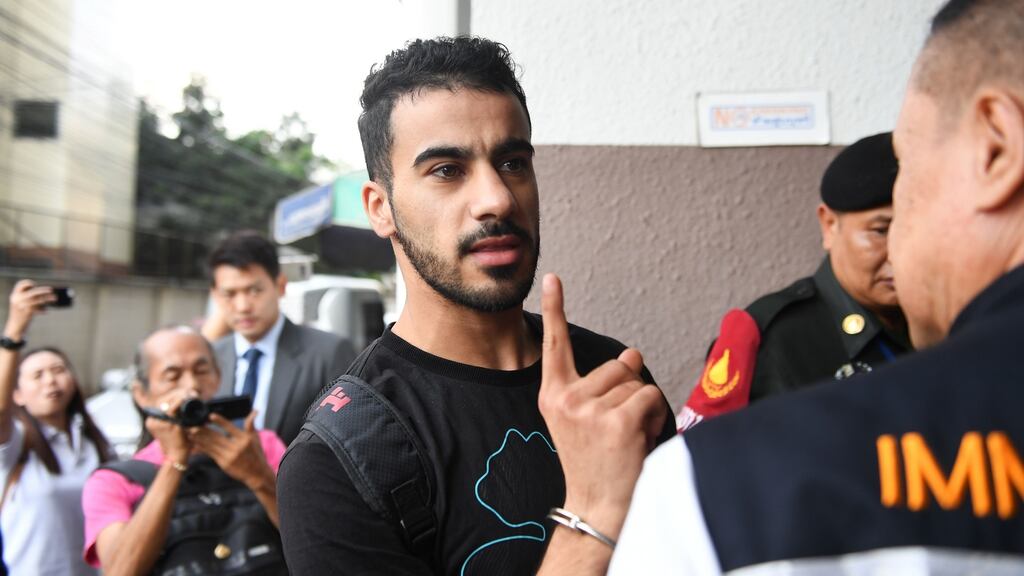 Hakeem al-Araibi, a former Bahrain national team footballer with refugee status in Australia, is escorted by immigration police to a court in Bangkok on December 11th, 2018. Photograph: Lillian Suwanrumpha/AFP