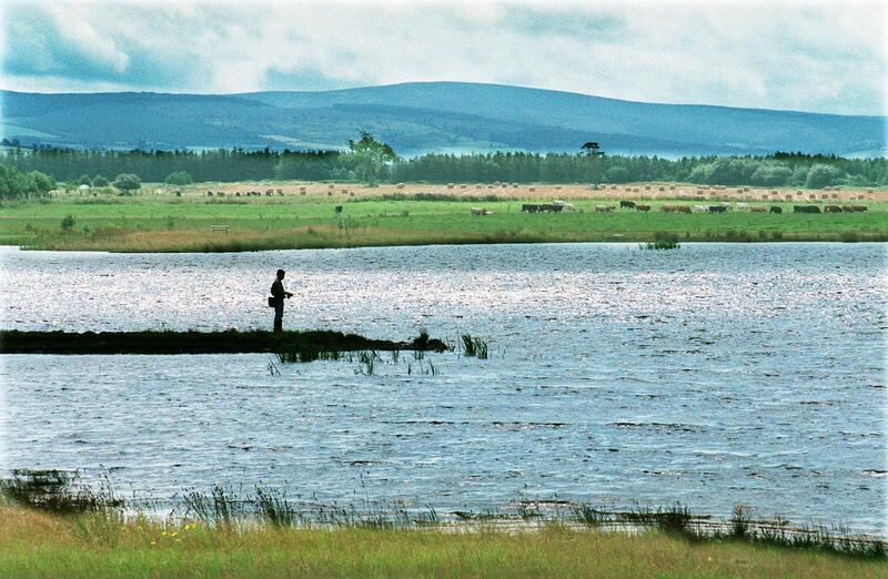 A fisherman on the lakes on the bog at Lough Boora Parklands