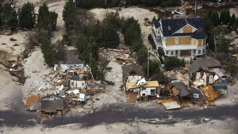 A lone house stands on the shoreline among destroyed homes after Hurricane Sandy came ashore in New Jersey in 2012, the backdrop to Richard Ford’s new book. Photograph: Reuters