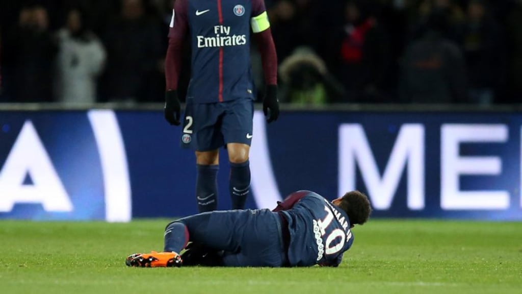 Paris Saint-Germain’s Neymar lies on the pitch after breaking his metatarsal. Photo: Stephane Mahe/Reuters