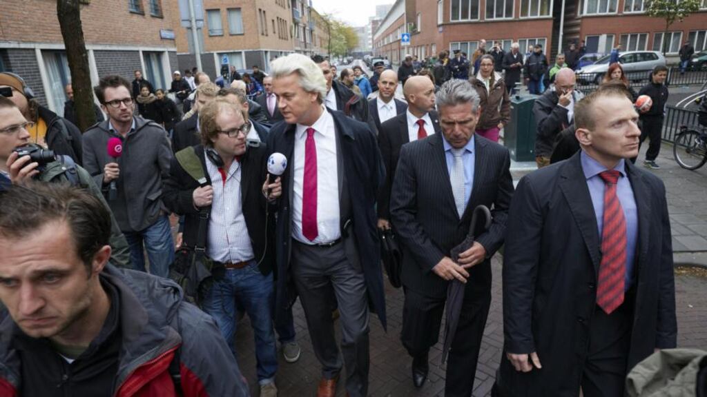 The leader of the Dutch far-right Party for Freedom Geert Wilders speaks to the press during his visit to the Schilderswijk district in The Hague. Photograph: Martijn Beekman/AFP/Getty Images