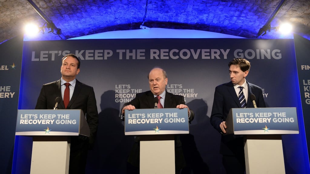 Minister for Finance Michael Noonan (centre), with Leo Varadkar TD (L) and Simon Harris (R), announcing plans to abolish the USC by 2020. Photograph: Dara Mac Dónaill/The Irish Times