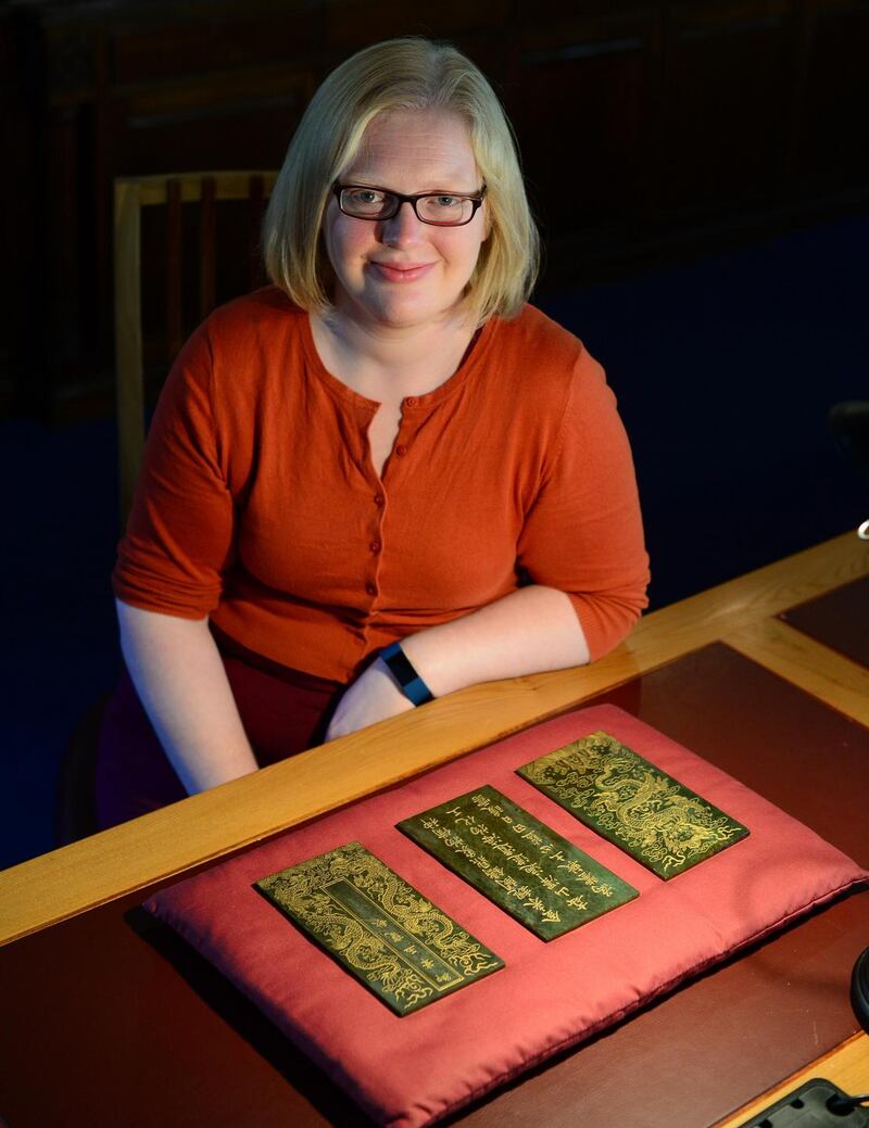 Chester Beatty Library: Mary Redfern with folios from the Song of the Jade Bowl. Photograph: Bryan O’Brien