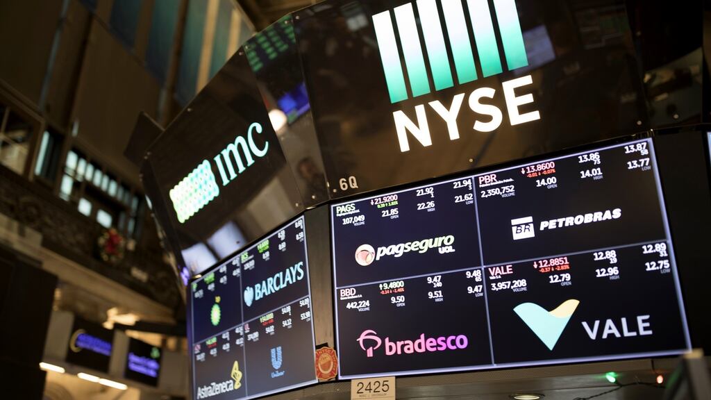 NYSE screens as beaten-down tech shares led the rebound in US stocks, while Treasuries fell as investors gained confidence from positive political developments in Europe and rising oil prices. Photograph: Jordan Sirek/Bloomberg